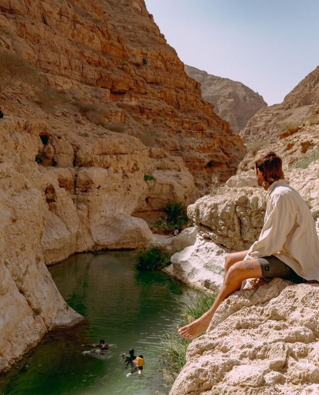 man in a wadi in Oman