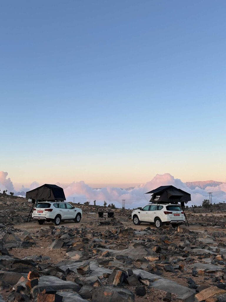 4x4 with rooftop tents in the mountains above the clouds